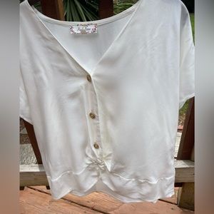Blouse with tied front.